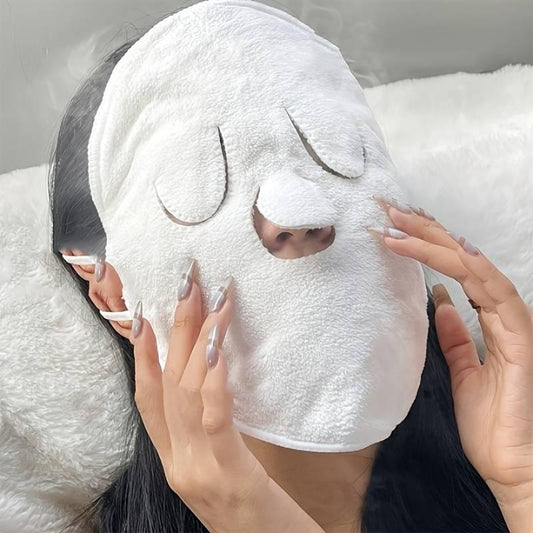 Hot compress face towel mask for skin care, providing soothing treatment at home or beauty salon.