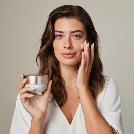 Model applying RITUALS The Ritual of Namaste Anti-Ageing Day Cream 50ml for radiant skin.