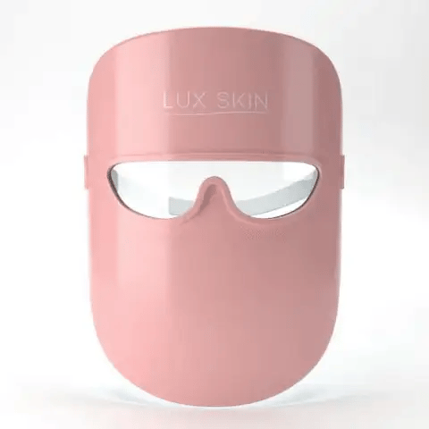 LUX SKIN® LED Facial Mask in pink, designed for anti-aging and acne treatment with medical grade light therapy.