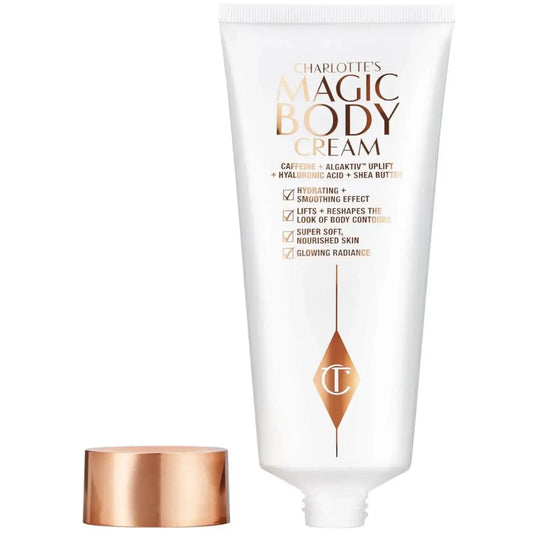 Charlotte Tilbury's Magic Body Cream 50ml tube, rich in caffeine, hydrates and nourishes skin for a glowing, soft appearance.
