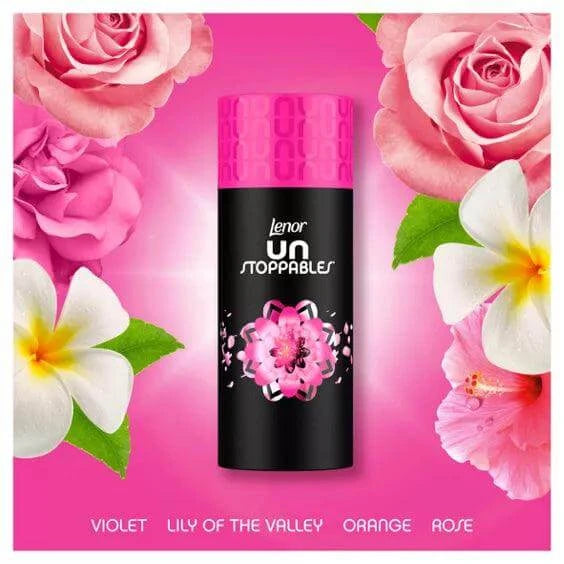 Lenor Unstoppables scent booster bottle surrounded by flowers, featuring vibrant pink and floral design for laundry freshness.