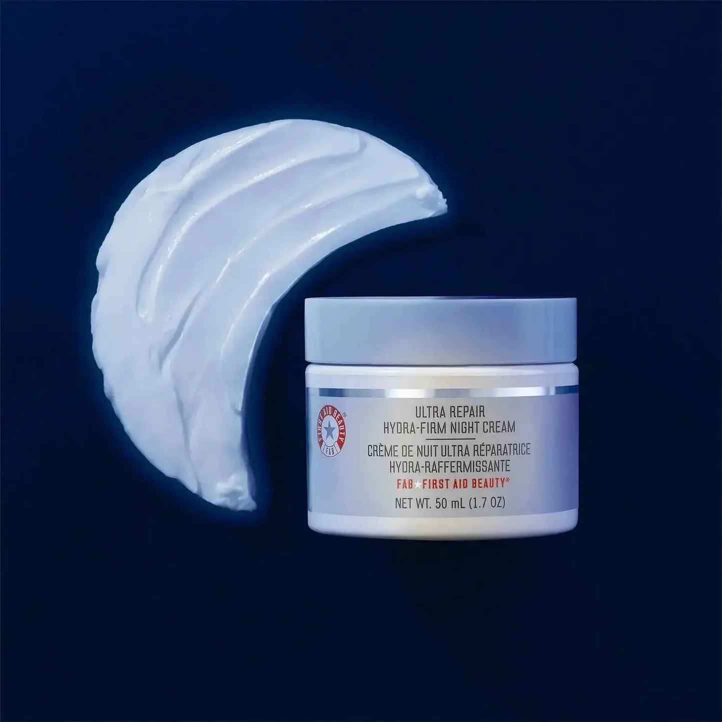 First Aid Beauty Ultra Repair Hydra-Firm Night Cream jar with creamy texture, promoting hydration and firm skin overnight.