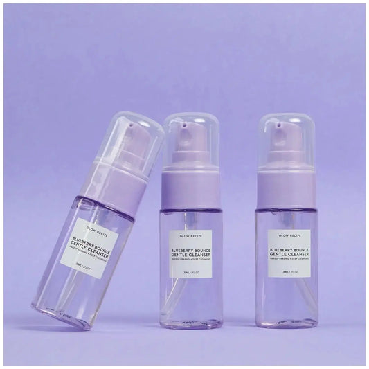 GLOW RECIPE Blueberry Bounce Gentle Cleanser bottles on a lavender background, showcasing a refreshing skincare product.