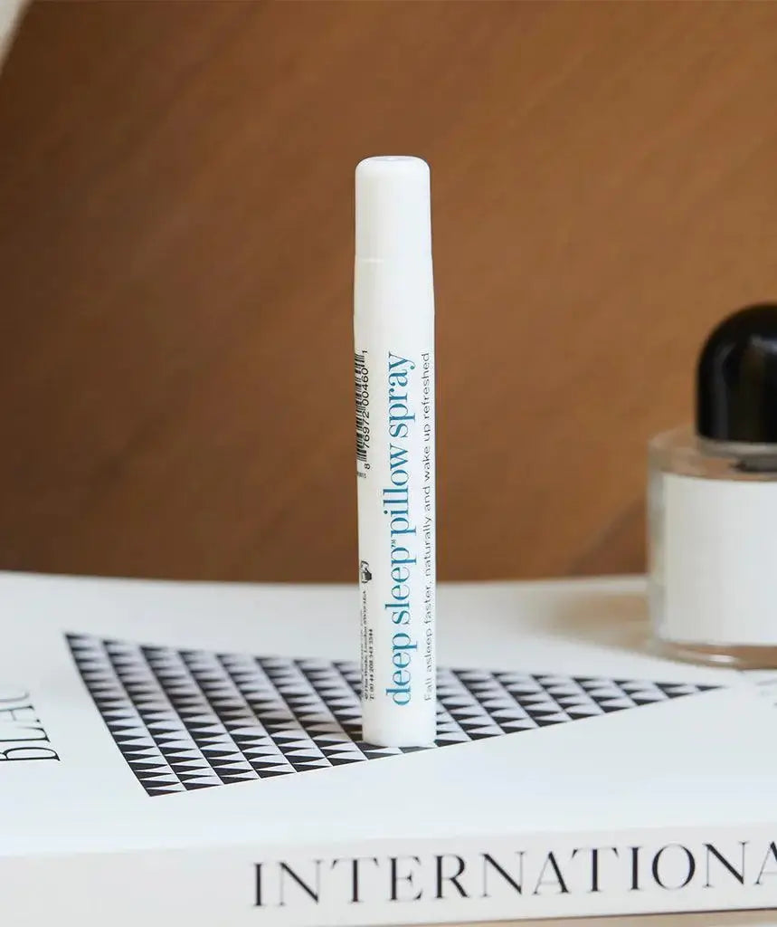 thisworks Deep Sleep Pillow Spray 10ml on a book, ideal for promoting restful sleep with natural Eucalyptus and Frankincense.