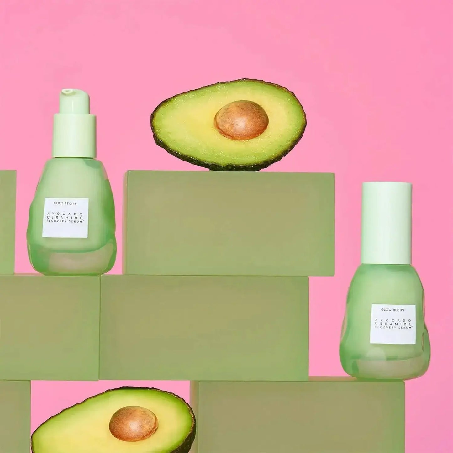 GLOW RECIPE Avocado Serum 30ml bottles on blocks with fresh avocado, showcasing nourishing skincare and vibrant colors.