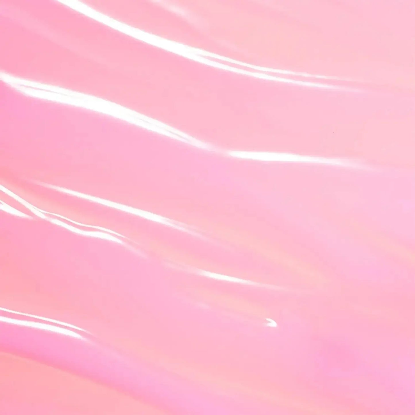 Close-up of a smooth, glossy pink serum texture, ideal for skincare and enhancing brightening effects.