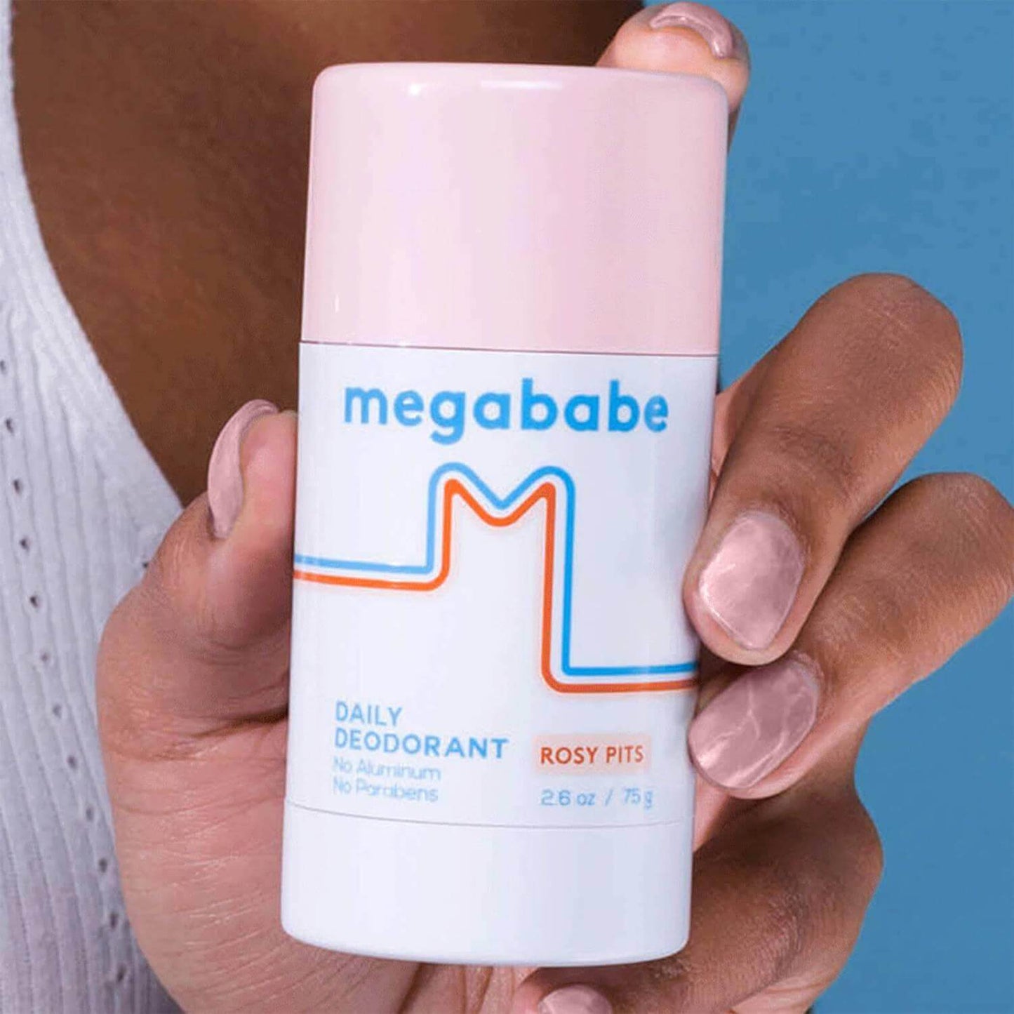 Megababe Rosy Pits Daily Deodorant 75g held in hand, showcasing its natural and aluminium-free formula.