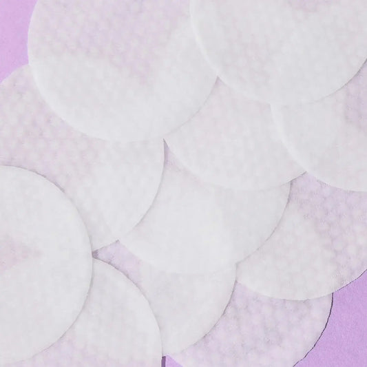 First Aid Beauty BHA and AHA Ingrown Hair Pads on a purple background, ideal for reducing ingrown hairs and razor bumps.