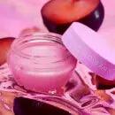 GLOW RECIPE Plum Hyaluronic Gloss Balm in a jar with plums, showcasing a moisturizing lip balm for a smooth, glossy finish.