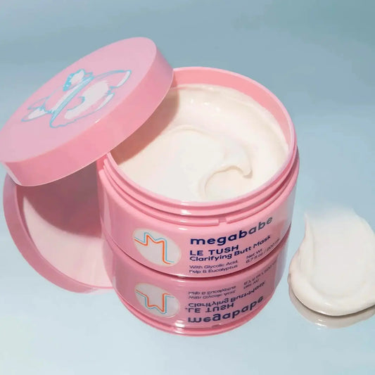 Megababe Le Tush Clarifying Butt Mask 200ml in a pink jar, showcasing creamy texture for smooth skin.