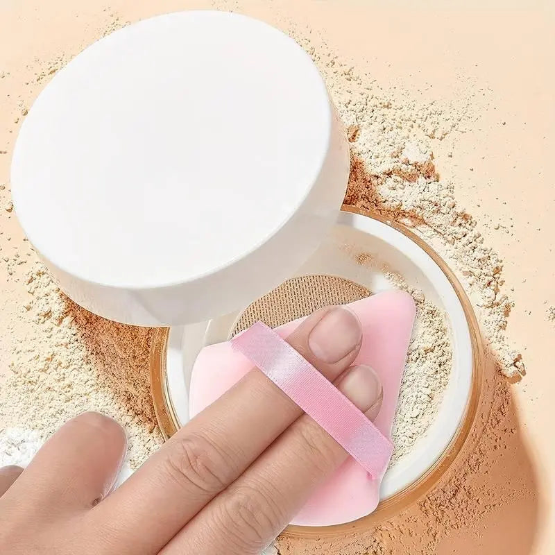 15pcs Hair Dressing Beauty Tools Kit showing a finger holding a makeup puff next to a powder container.