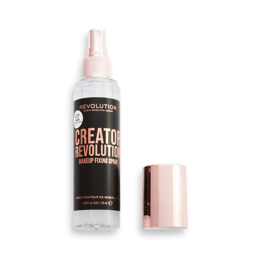 Revolution Fix Setting Spray bottle with rose gold cap, designed for long-lasting makeup hold and a glowing finish.