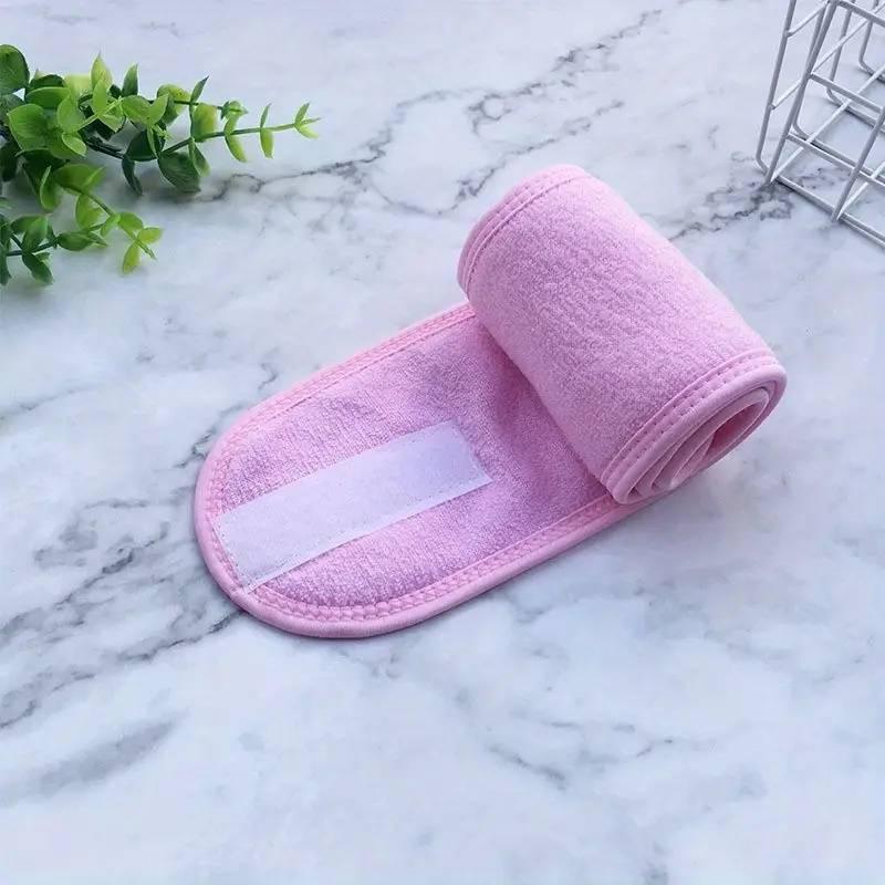 Soft pink adjustable hairband for women, ideal for washing face, yoga, sports, and running.