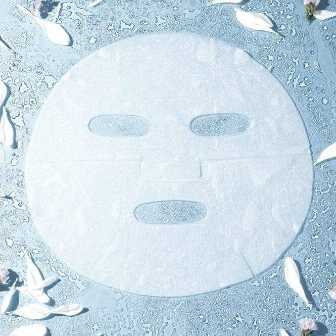 Herbal Essentials Rescue Revive Facial Sheet Mask on a light blue surface with rose petals, promoting hydration and nourishment.