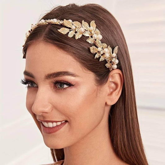 Faux pearl leaf decor headband in golden color, featuring a vintage baroque design, stylishly worn by a model.