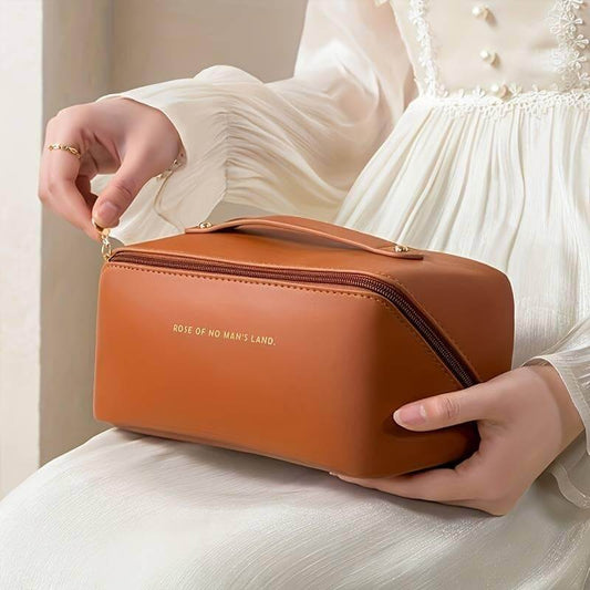Large capacity water-resistant makeup toiletry bag in brown, stylish design for storing cosmetics and personal items.