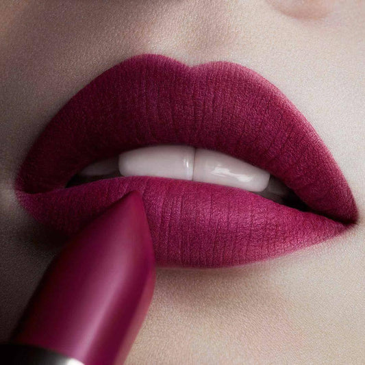 L'Oreal Color Riche Matte Lipstick in 463 Plum Tuxedo on lips, showcasing a rich matte finish and vibrant color.