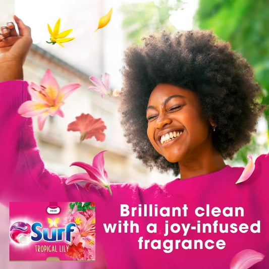 Surf Tropical Lily laundry capsules with joyful woman enjoying floral fragrance and clean freshness.