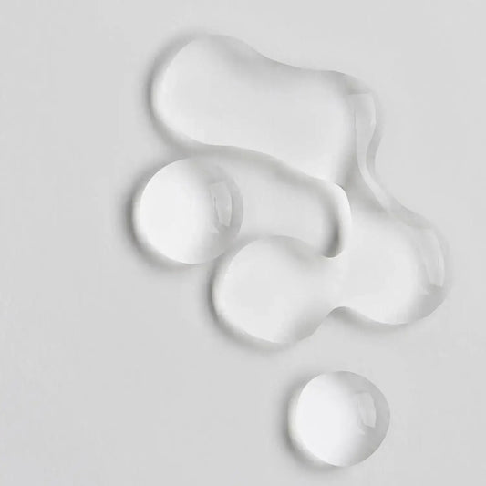 Close-up of clear gel drops representing The INKEY List Collagen Peptide Serum's lightweight formula.