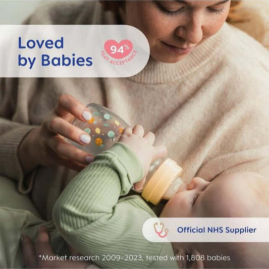 Mother feeding baby with MAM glass bottle, showcasing 94% baby acceptance, NHS supplier.