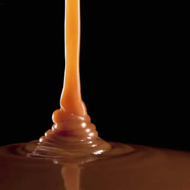 Smooth caramel drizzling over rich chocolate, showcasing indulgent Aero Melts experience.