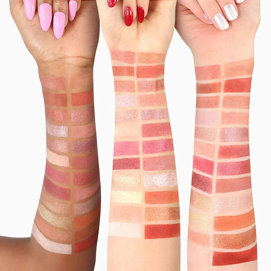 Swatches of the CIATE London I Am Woman Eyeshadow Palette V2 on diverse skin tones, showcasing 24 vibrant shades.
