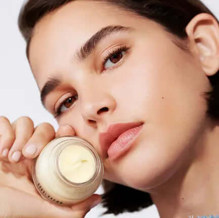 Model showcasing Bobbi Brown Vitamin Enriched Face Base 15ml with a smooth, hydrated complexion and minimal makeup.