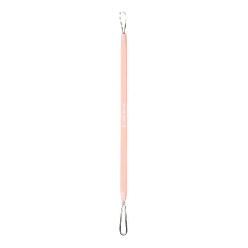 Brushworks blackhead removal tool in pink with stainless steel ends for hygienic skincare.