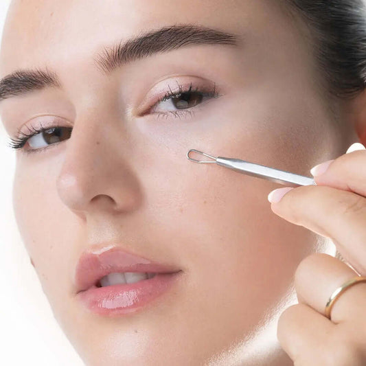 Model using Brushworks Blackhead and Blemish Remover Set tool on her face for skin care.