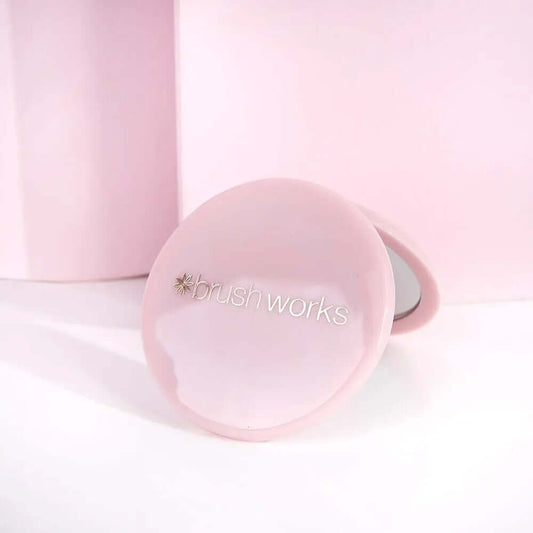 Brushworks compact mirror in hot pink for on-the-go touch-ups, small and discreet for handbags.