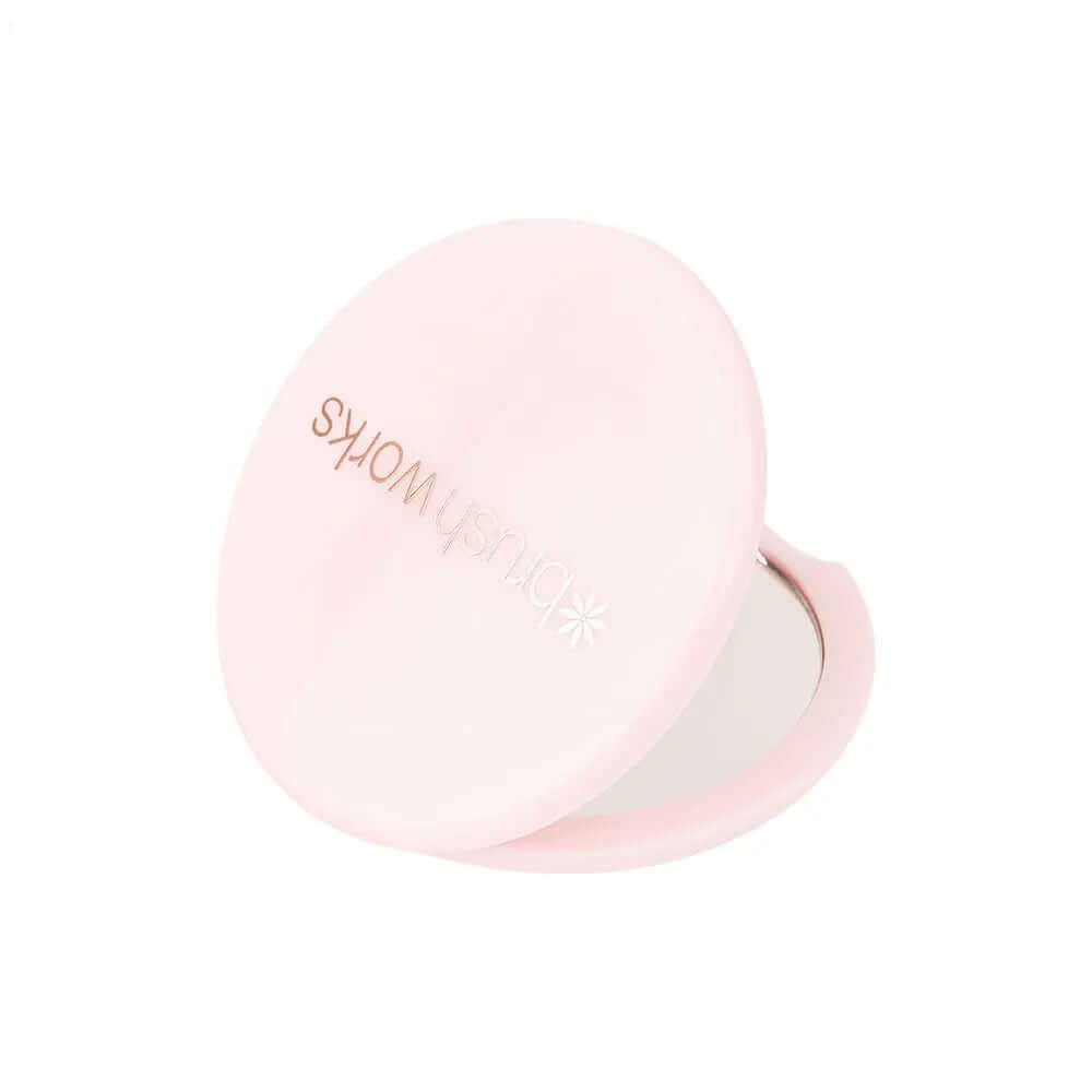 Brushworks Compact Mirror in pink, perfect for on-the-go beauty touch-ups and discreetly fitting in your handbag.