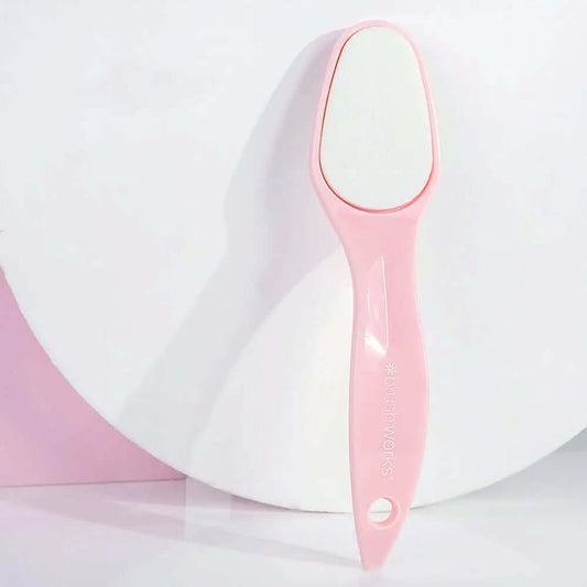Brushworks Foot File in pink, designed to easily remove dry skin for soft, smooth feet with an ergonomic handle.