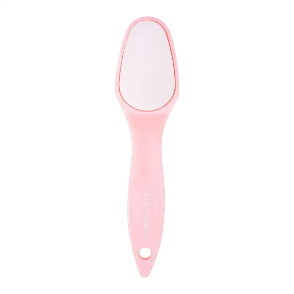 Brushworks Foot File in pink, designed to remove dry skin for soft, smooth feet with ergonomic handle for easy use.