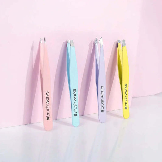 Brushworks HD Combination Tweezer Set in pastel colors for precise eyebrow grooming and shaping.