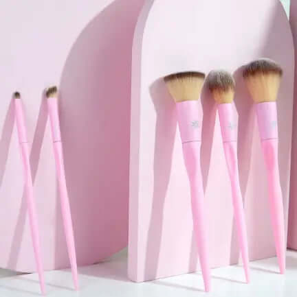 Brushworks HD Complete Face Set featuring six pink makeup brushes against a pastel backdrop.
