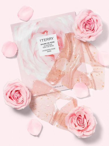By Terry balm with pink roses and packaging on a light background