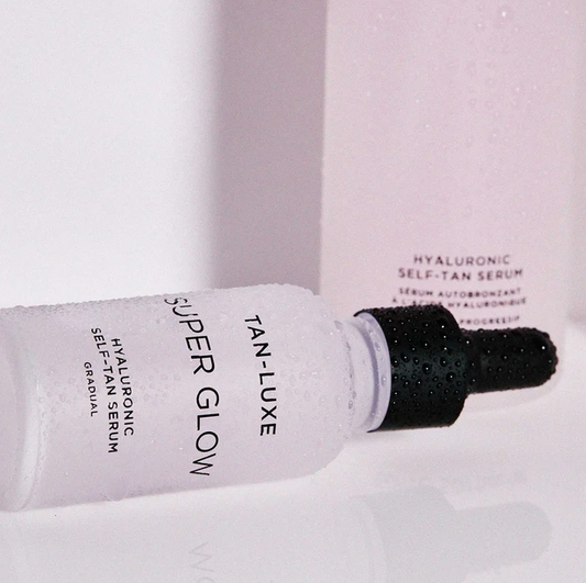 Tan-Luxe Super Glow Hyaluronic Self-Tan Serum in a dropper bottle for hydration and tanning benefits.