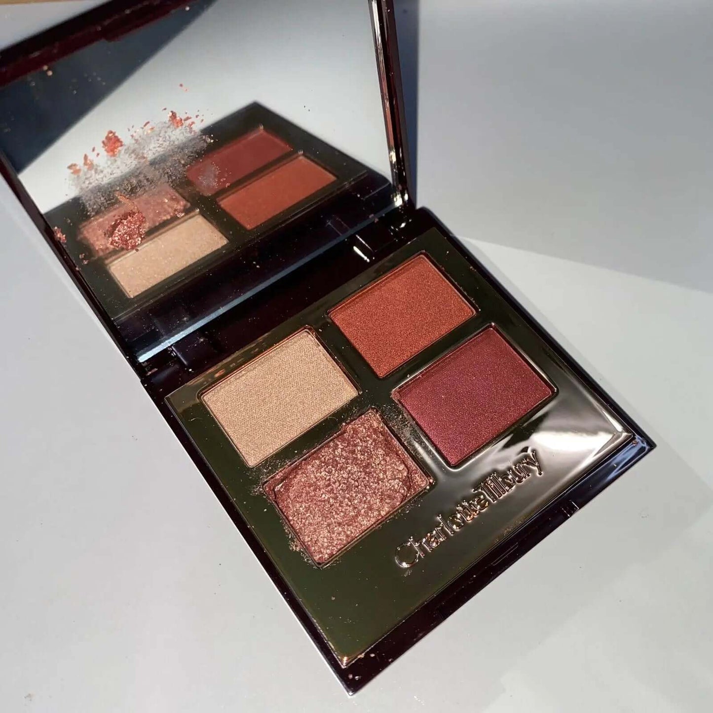 Charlotte Tilbury Pillow Talk eyeshadow palette featuring four shimmer and matte shades in elegant compact.