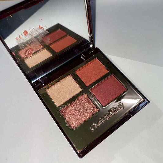 Charlotte Tilbury Pillow Talk eyeshadow palette featuring four shimmer and matte shades in elegant compact.