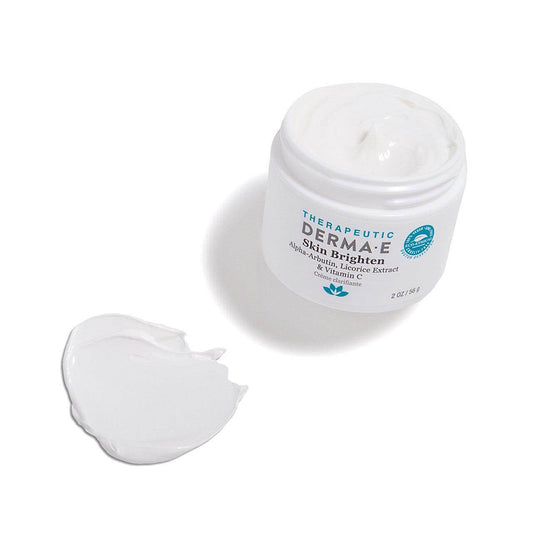Derma-E Skin Brighten cream jar with a dollop of cream, enriched with alpha-arbutin and licorice extract.