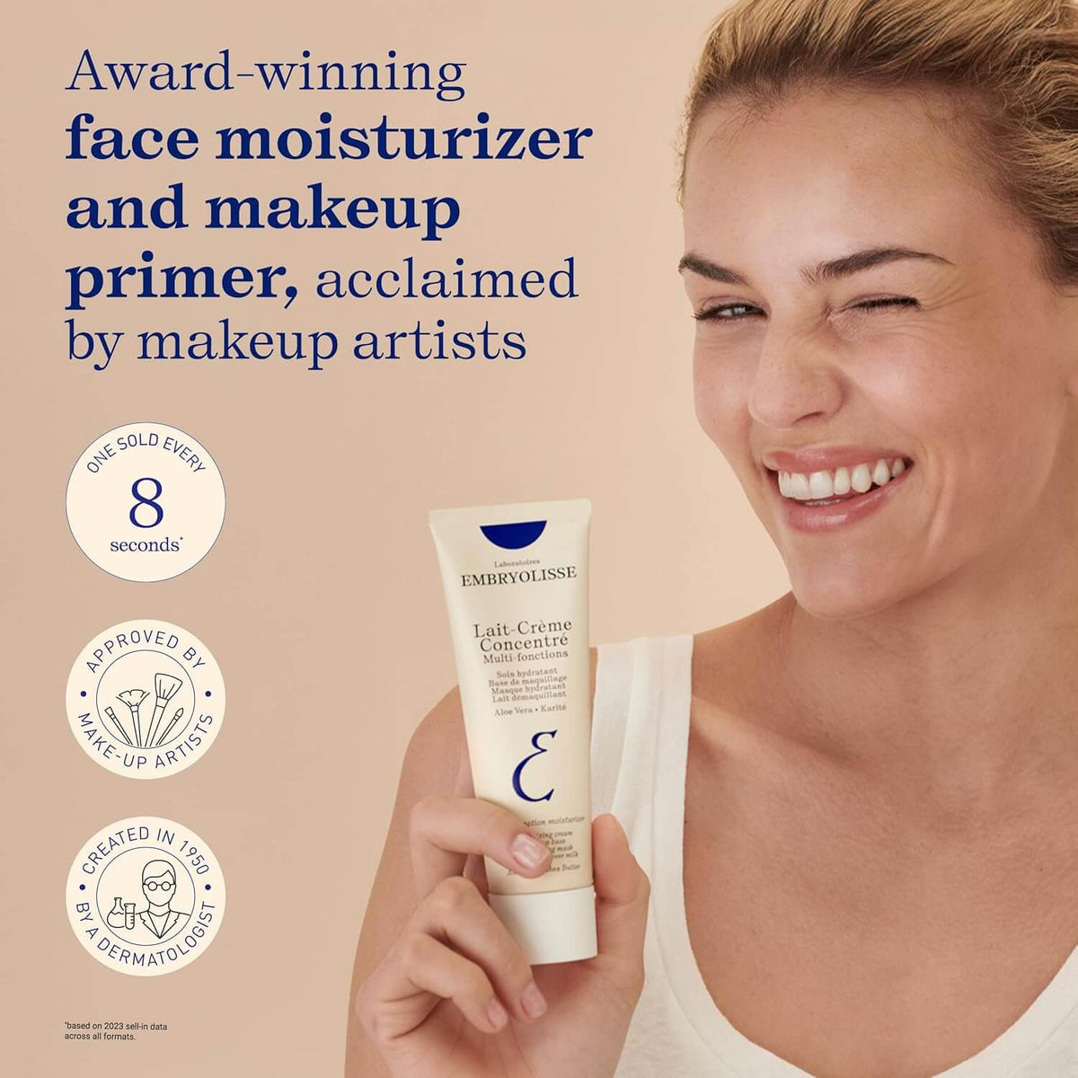 Woman holding Embryolisse face moisturizer with product details on a beige background