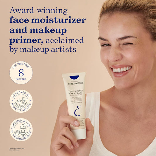 Woman holding Embryolisse face moisturizer with product details on a beige background