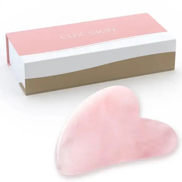 LUX SKIN® Gua Sha Rose Quartz Stone with elegant packaging, promoting anti-aging and skincare benefits.