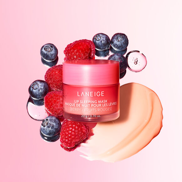 Laneige lip sleeping mask surrounded by berries on a pink background
