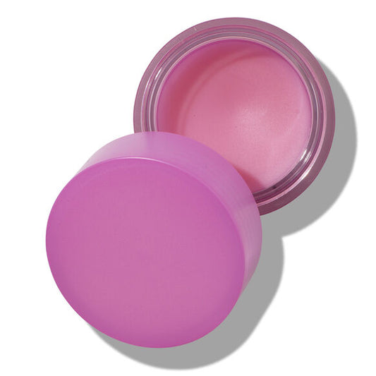 Pink lip balm container with pink lip balm on a white background
