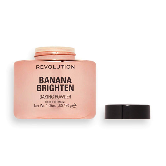Revolution Banana Brighten Loose Baking Powder in a pink container, ideal for a radiant finish.