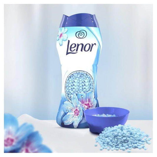 Lenor In-Wash Scent Booster Spring Awakening with blue pearls and flowers, ensuring long-lasting freshness.