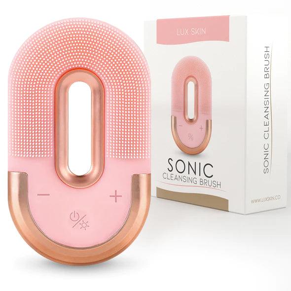LUX SKIN® Sonic LED Cleansing Brush with pink design, combining sonic vibrations and LED light therapy for skincare.