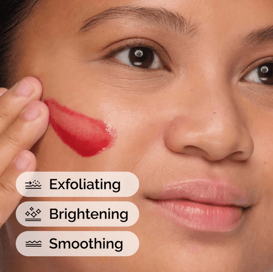 Person applying The Ordinary AHA 30% + BHA 2% Peeling Solution 30ml red exfoliating product on their cheek, highlighting benefits of exfoliating, brightening, and smoothing.