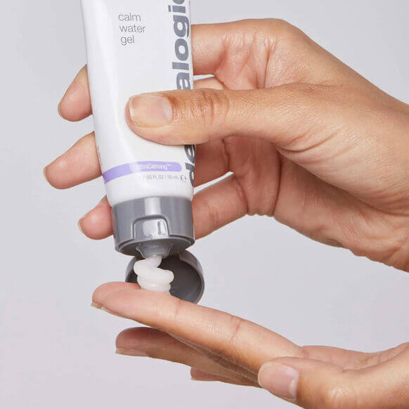 Hand dispensing Dermalogica Calm Water Gel, a hydrating formula for sensitive skin, showcasing its creamy texture.